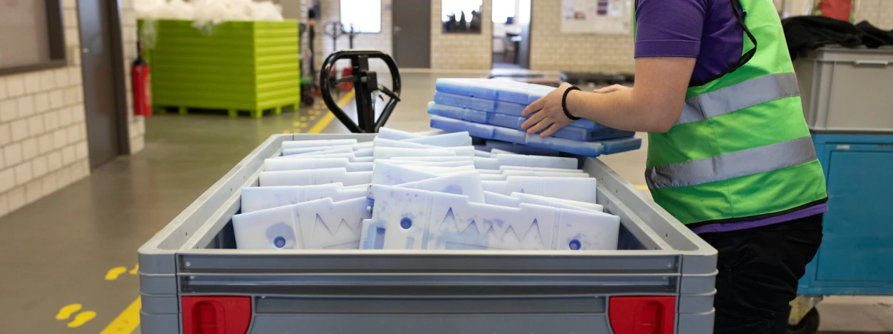 SWISS WorldCargo certified personnel preparing passive packaging for pharma and perishables